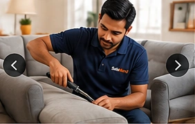 SofaMend professional repairing a grey sofa